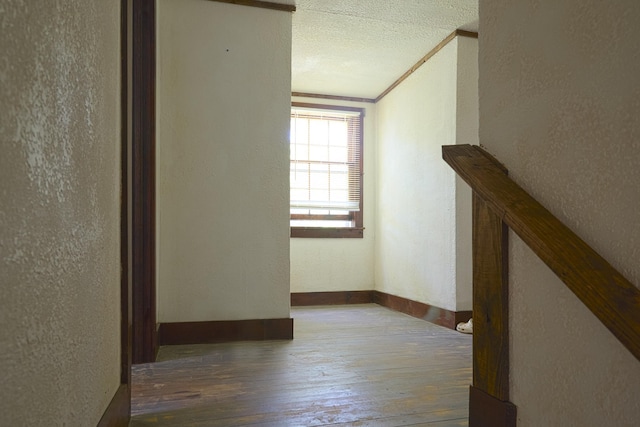 3281 Pulaski Hwy, Lawrenceburg, TN 38464 - hallway with a textured wall, wood-type flooring, a textured ceiling, and crown molding