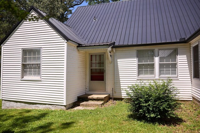3281 Pulaski Hwy, Lawrenceburg, TN 38464 - view of front of home with metal roof and a front yard
