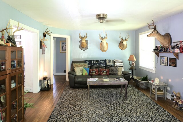 3281 Pulaski Hwy, Lawrenceburg, TN 38464 - living area featuring wood finished floors, baseboards, and ceiling fan