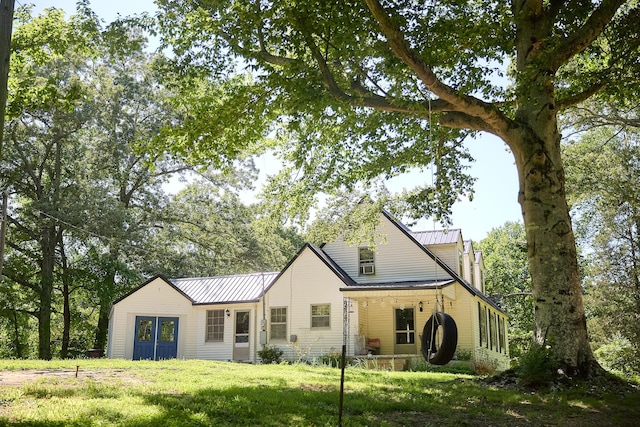 3281 Pulaski Hwy, Lawrenceburg, TN 38464 - traditional-style home with metal roof, a front yard, and a standing seam roof