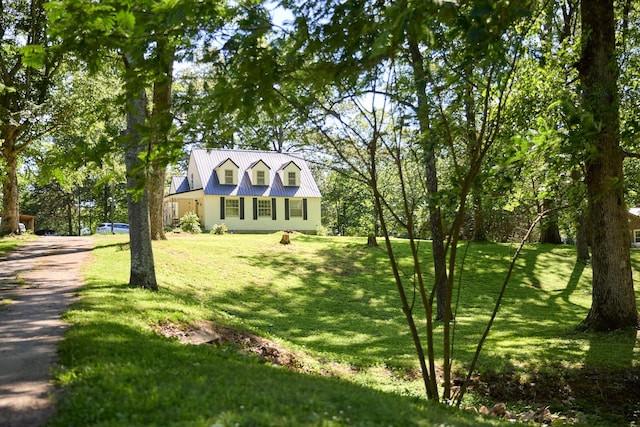 3281 Pulaski Hwy, Lawrenceburg, TN 38464 - view of front of home featuring metal roof, a front yard, and driveway