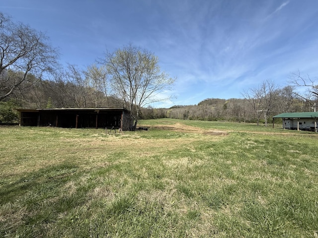 2001 Scotty Parker Rd, Gallatin, TN 37066 - view of green lawn with an outbuilding and a carport