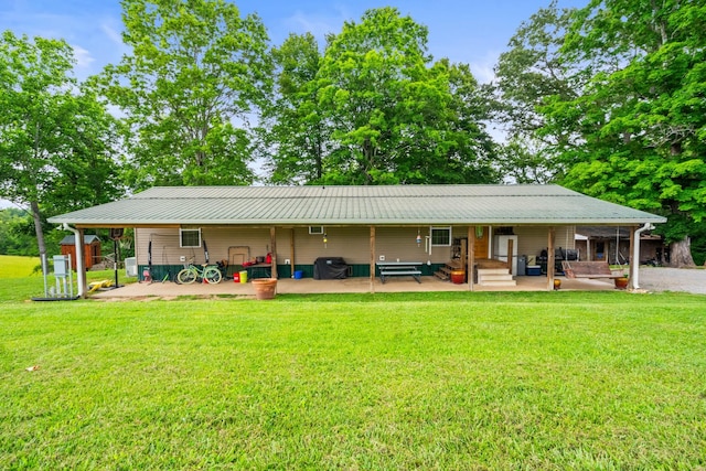 2751 Jarrell Ridge Rd, Clarksville, TN 37043 - back of house featuring a lawn and metal roof
