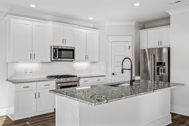 528 Kingwood Ln, White House, TN 37188 - kitchen featuring appliances with stainless steel finishes, a sink, crown molding, light stone countertops, and dark wood finished floors