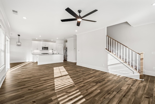528 Kingwood Ln, White House, TN 37188 - unfurnished living room with crown molding, baseboards, a ceiling fan, dark wood finished floors, and recessed lighting