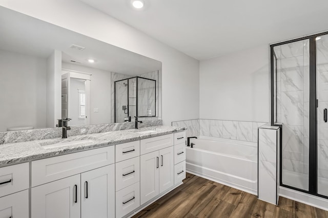 528 Kingwood Ln, White House, TN 37188 - full bath featuring a bath, a marble finish shower, double vanity, wood finished floors, and recessed lighting