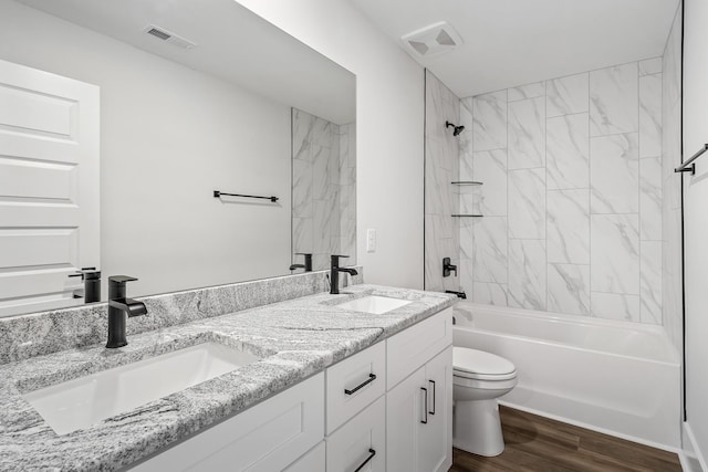 528 Kingwood Ln, White House, TN 37188 - bathroom featuring toilet, double vanity, wood finished floors, and washtub / shower combination