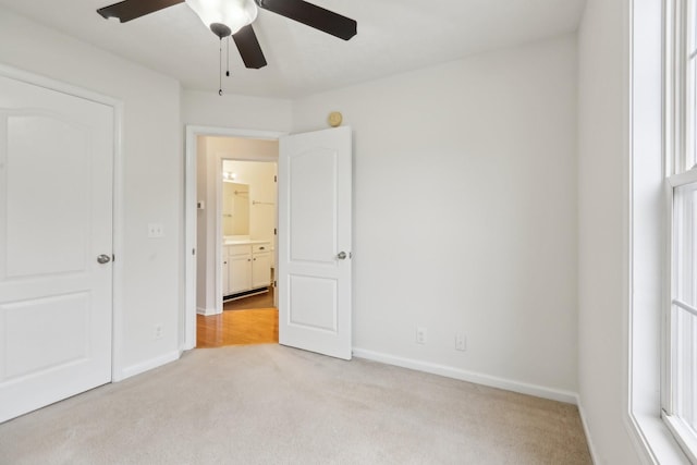 2889 Sharpie Dr, Clarksville, TN 37040 - unfurnished bedroom with light carpet, baseboards, and ceiling fan