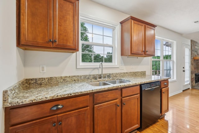 2889 Sharpie Dr, Clarksville, TN 37040 - kitchen featuring black dishwasher, a sink, plenty of natural light, and light wood-type flooring