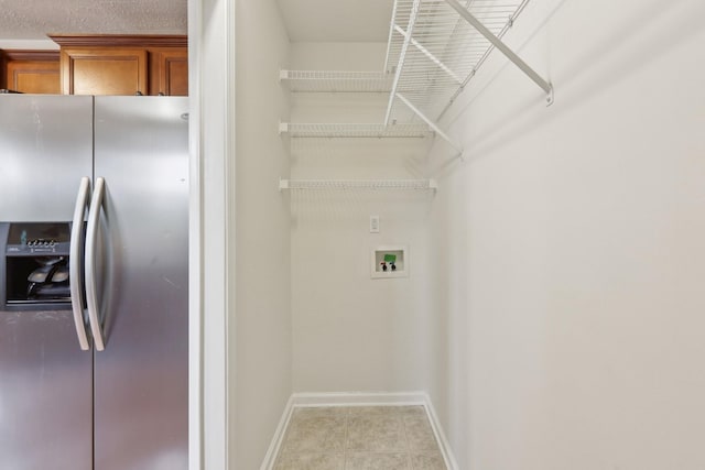 2889 Sharpie Dr, Clarksville, TN 37040 - laundry area with baseboards, washer hookup, and light tile patterned floors