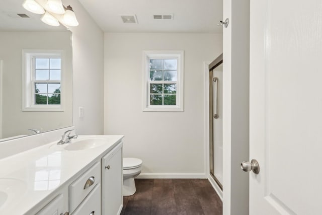 2889 Sharpie Dr, Clarksville, TN 37040 - full bathroom featuring toilet, double vanity, a shower stall, and baseboards