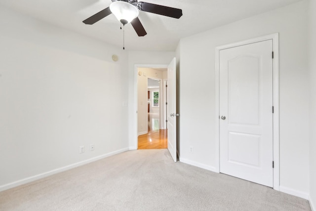 2889 Sharpie Dr, Clarksville, TN 37040 - unfurnished bedroom with light carpet, baseboards, and a ceiling fan