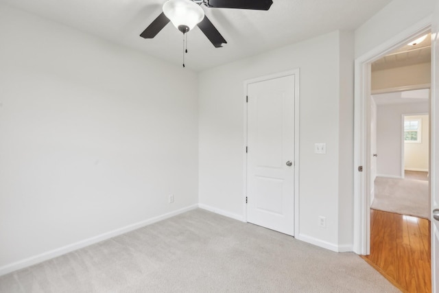 2889 Sharpie Dr, Clarksville, TN 37040 - unfurnished bedroom with light carpet, baseboards, and a ceiling fan