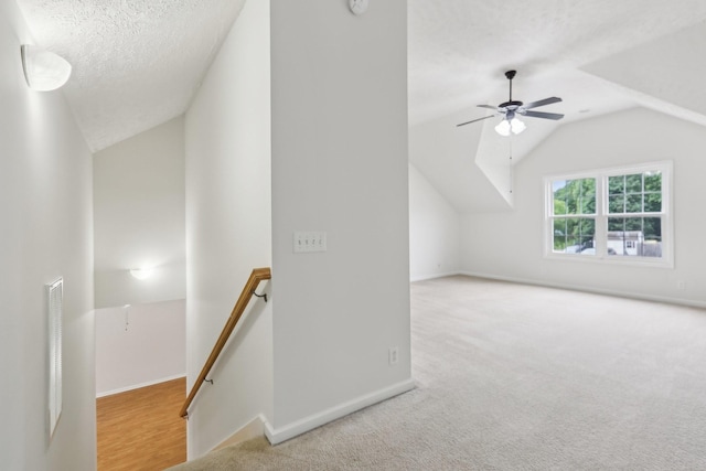 2889 Sharpie Dr, Clarksville, TN 37040 - bonus room with lofted ceiling, a ceiling fan, carpet flooring, baseboards, and a textured ceiling
