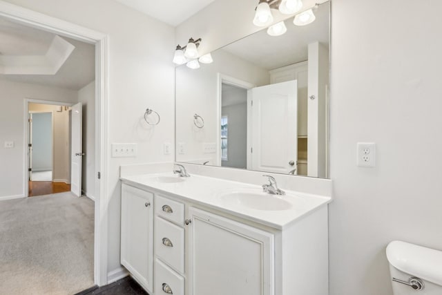 2889 Sharpie Dr, Clarksville, TN 37040 - full bathroom with double vanity, toilet, and baseboards