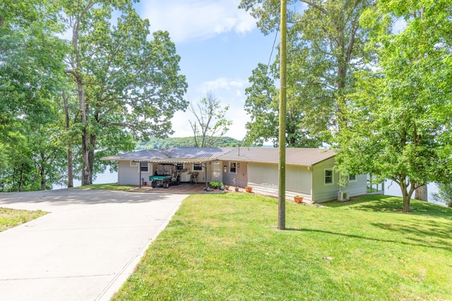 440 Bluff Point Ln, Waverly, TN 37185 - ranch-style home featuring driveway, a front yard, and metal roof