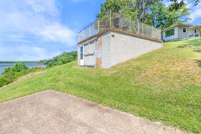 440 Bluff Point Ln, Waverly, TN 37185 - view of side of home with a yard and a water view
