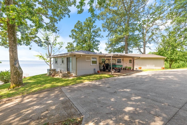 440 Bluff Point Ln, Waverly, TN 37185 - single story home with a water view, driveway, and a front yard