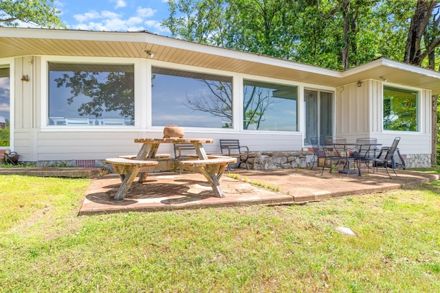 440 Bluff Point Ln, Waverly, TN 37185 - rear view of house featuring a patio, a lawn, board and batten siding, and crawl space