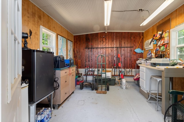 440 Bluff Point Ln, Waverly, TN 37185 - miscellaneous room with wood walls, concrete floors, and plenty of natural light