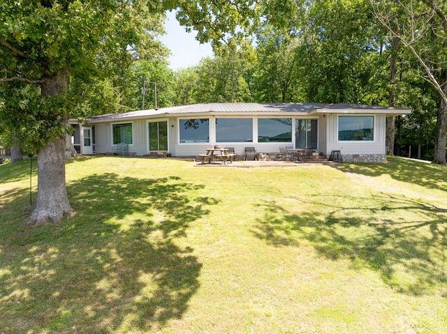 440 Bluff Point Ln, Waverly, TN 37185 - ranch-style house featuring a front yard, board and batten siding, crawl space, and a patio area