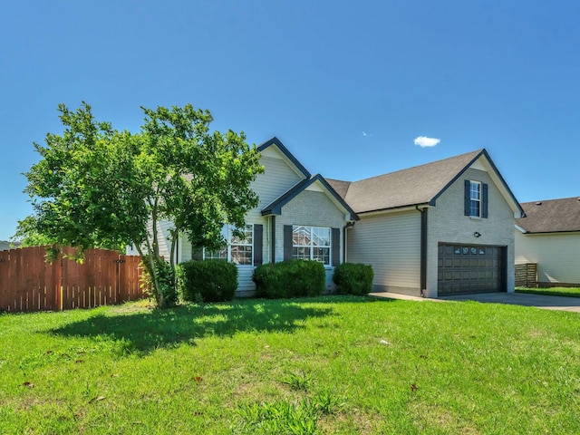 3825 Roscommon Way, Clarksville, TN 37040 - view of front of house featuring asphalt driveway, brick siding, and an attached garage