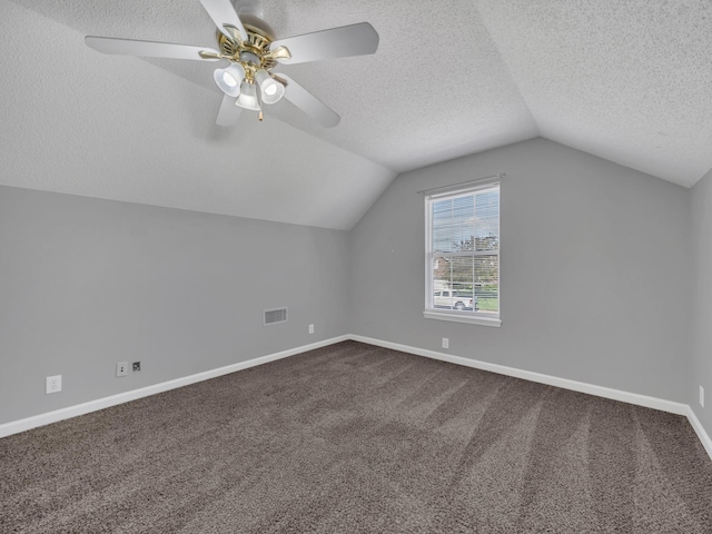 3825 Roscommon Way, Clarksville, TN 37040 - additional living space featuring lofted ceiling, a textured ceiling, dark colored carpet, a ceiling fan, and baseboards
