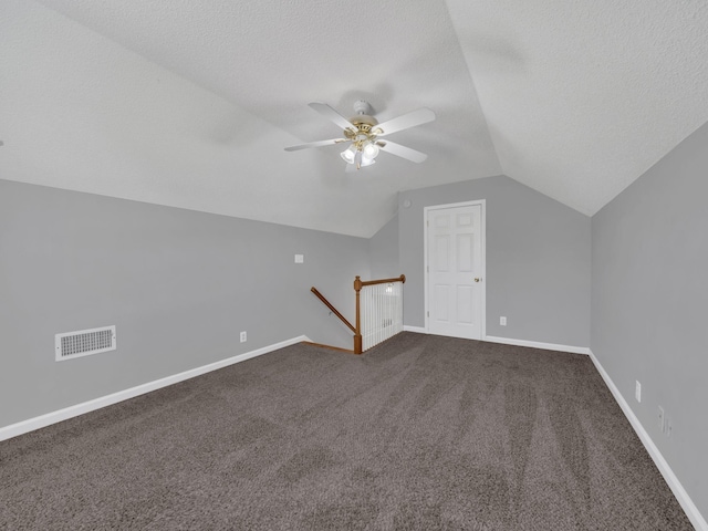 3825 Roscommon Way, Clarksville, TN 37040 - bonus room with vaulted ceiling, ceiling fan, a textured ceiling, dark colored carpet, and baseboards