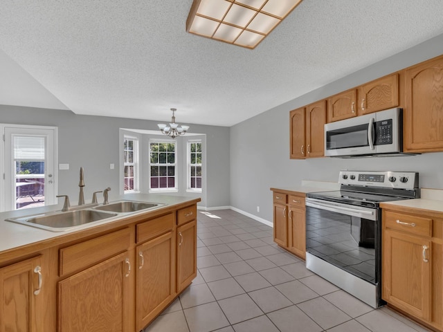 3825 Roscommon Way, Clarksville, TN 37040 - kitchen featuring stainless steel appliances, a sink, light countertops, a chandelier, and light tile patterned floors