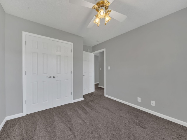 3825 Roscommon Way, Clarksville, TN 37040 - unfurnished bedroom featuring dark colored carpet, baseboards, a closet, and a ceiling fan