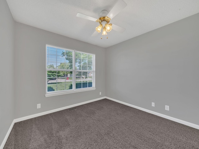3825 Roscommon Way, Clarksville, TN 37040 - unfurnished room featuring dark carpet, baseboards, and a textured ceiling