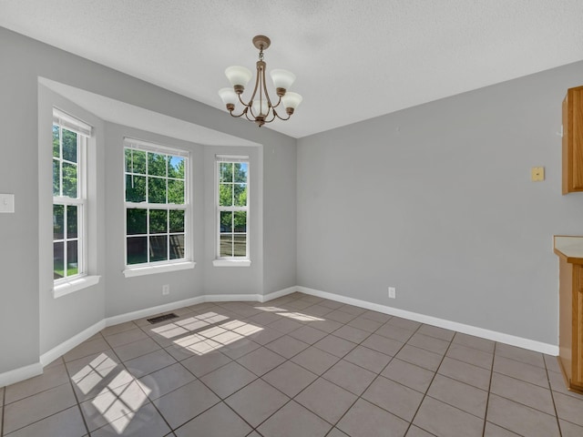 3825 Roscommon Way, Clarksville, TN 37040 - unfurnished dining area with light tile patterned floors, a chandelier, a textured ceiling, and baseboards