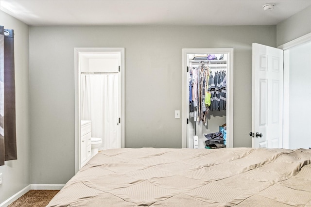 84 Del Toro Dr, Sparta, TN 38583 - carpeted bedroom with a closet, a walk in closet, ensuite bathroom, and baseboards