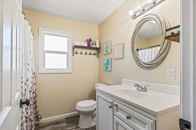 84 Del Toro Dr, Sparta, TN 38583 - bathroom featuring vanity, wood finished floors, toilet, and baseboards