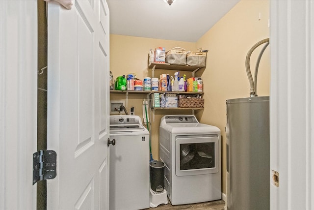 84 Del Toro Dr, Sparta, TN 38583 - laundry room featuring water heater, washer and dryer, and wood finished floors