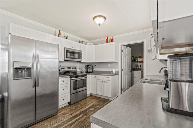 84 Del Toro Dr, Sparta, TN 38583 - kitchen featuring stainless steel appliances, a sink, ornamental molding, white cabinets, and dark wood finished floors