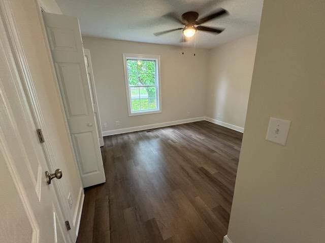 803 17th Ave E, Springfield, TN 37172 - unfurnished room with ceiling fan, baseboards, and dark wood finished floors