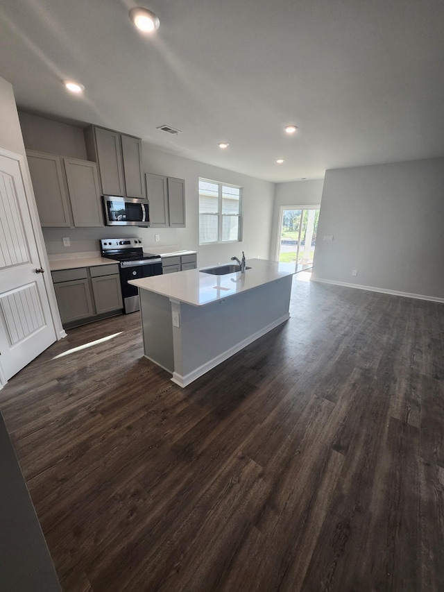 713 Walleye Way, Antioch, TN 37013 - kitchen featuring stainless steel appliances, gray cabinetry, a sink, dark wood-style flooring, and recessed lighting