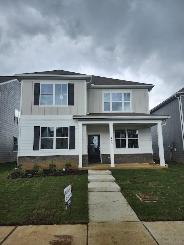 713 Walleye Way, Antioch, TN 37013 - view of front facade featuring board and batten siding, a front yard, and covered porch