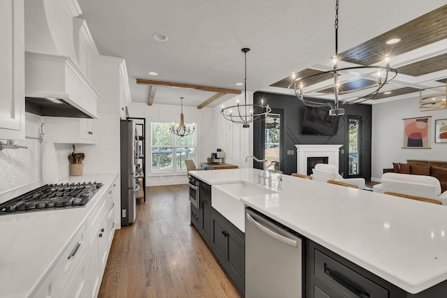4480 Old Murfreesboro Rd W, Lebanon, TN 37090 - kitchen featuring stainless steel appliances, a chandelier, open floor plan, white cabinets, and beam ceiling