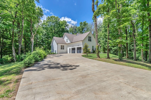 4480 Old Murfreesboro Rd W, Lebanon, TN 37090 - view of front facade featuring stucco siding, driveway, an attached garage, and a front yard