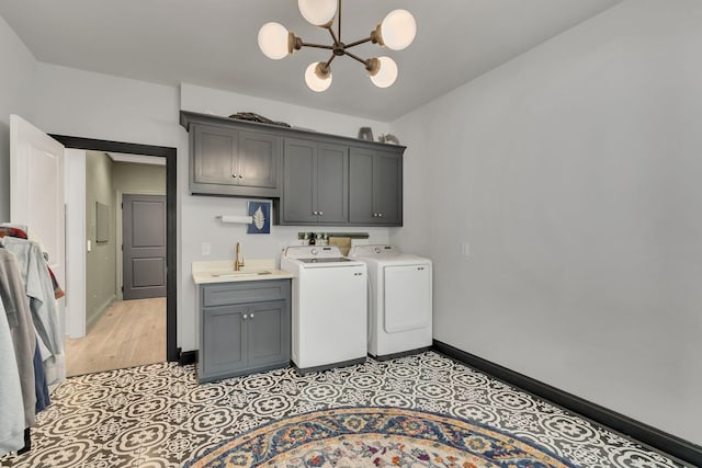 4480 Old Murfreesboro Rd W, Lebanon, TN 37090 - laundry room featuring cabinet space, washer and dryer, a chandelier, and baseboards