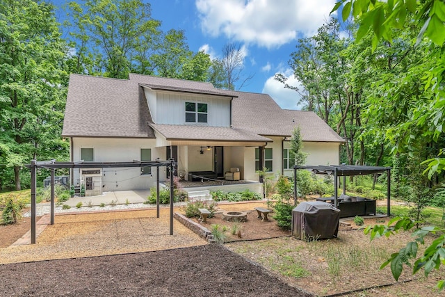 4480 Old Murfreesboro Rd W, Lebanon, TN 37090 - back of house with a patio area, a shingled roof, and a hot tub