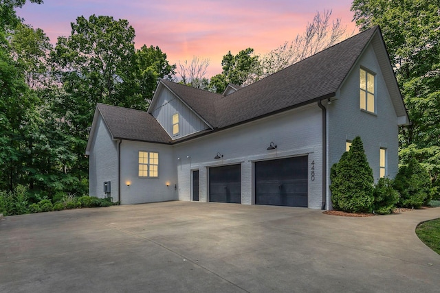 4480 Old Murfreesboro Rd W, Lebanon, TN 37090 - view of front of house with driveway, brick siding, a garage, and a shingled roof