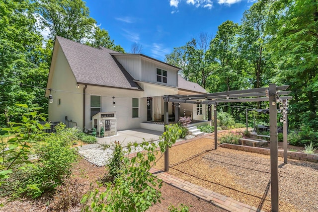 4480 Old Murfreesboro Rd W, Lebanon, TN 37090 - back of property featuring a shingled roof, a patio, a garden, and a pergola