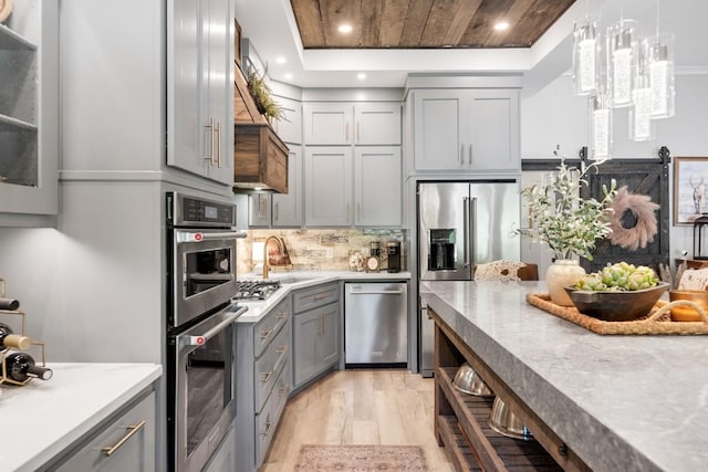 2878 Fly Rd, Santa Fe, TN 38482 - kitchen with gray cabinetry, appliances with stainless steel finishes, light wood-style flooring, recessed lighting, and decorative backsplash