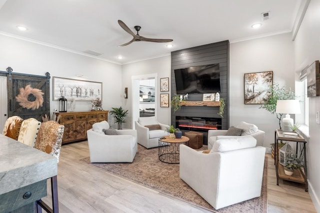 2878 Fly Rd, Santa Fe, TN 38482 - living room featuring a ceiling fan, a fireplace, light wood-type flooring, ornamental molding, and recessed lighting