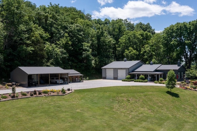 2878 Fly Rd, Santa Fe, TN 38482 - view of front of property with a front lawn, a carport, driveway, and an outbuilding