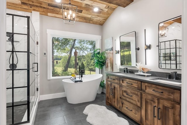 2878 Fly Rd, Santa Fe, TN 38482 - bathroom featuring double vanity, a stall shower, a freestanding bath, vaulted ceiling, and a chandelier