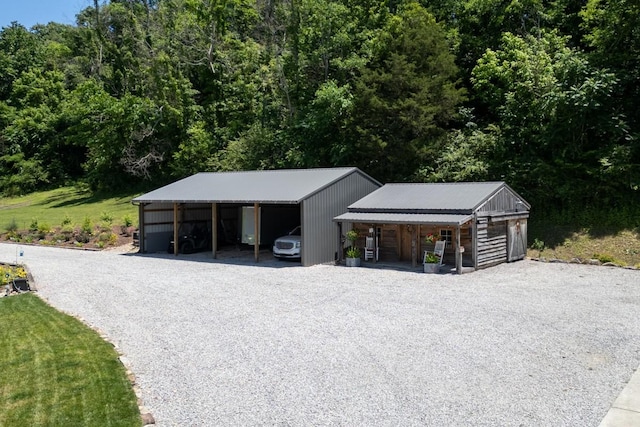 2878 Fly Rd, Santa Fe, TN 38482 - garage with driveway and a carport